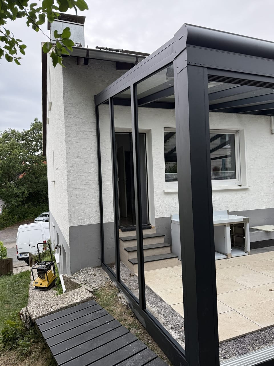 Terrassendach Green-500 mit VSG-Glasdach und Glasschiebewand, Möhnesee